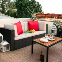 Outdoor all-weather rattan wicker double seater sofa with comfortable cushions, perfect for patio, balcony, or garden seating.