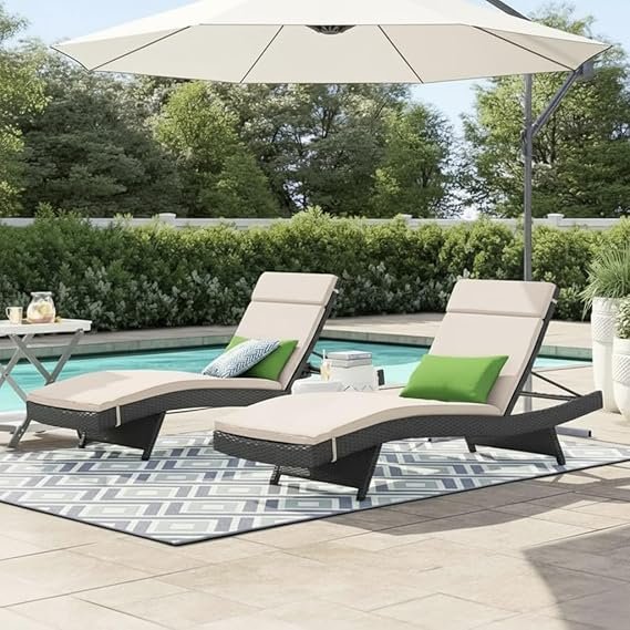 Stylish outdoor poolside lounger with comfortable cushions, perfect for sunbathing and relaxation