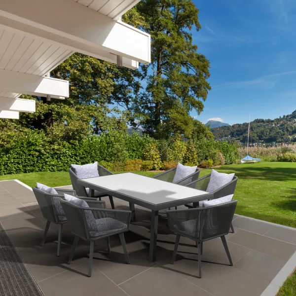 Modern 6-seater wooden dining set with cushioned chairs and polished tabletop
