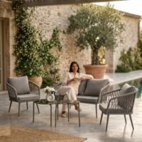 LOCCUS 4-Piece Outdoor Patio Furniture Set in grey with handwoven rope design, rustproof metal frame, and all-weather cushions. Includes a glass top center table, perfect for garden, balcony, lawn, or poolside outdoor seating.