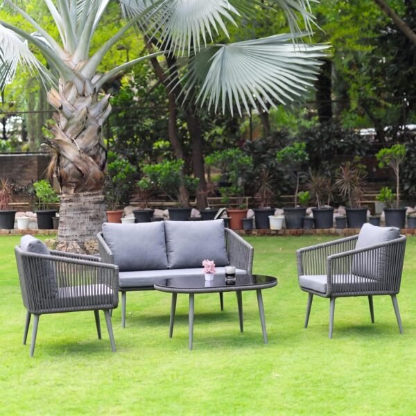 LOCCUS Outdoor Rope Sofa Set with seating for four, grey cushions, and a sleek glass top table. Built with a strong metal frame and handwoven rope, designed for garden, patio, pool deck, and balcony relaxation.