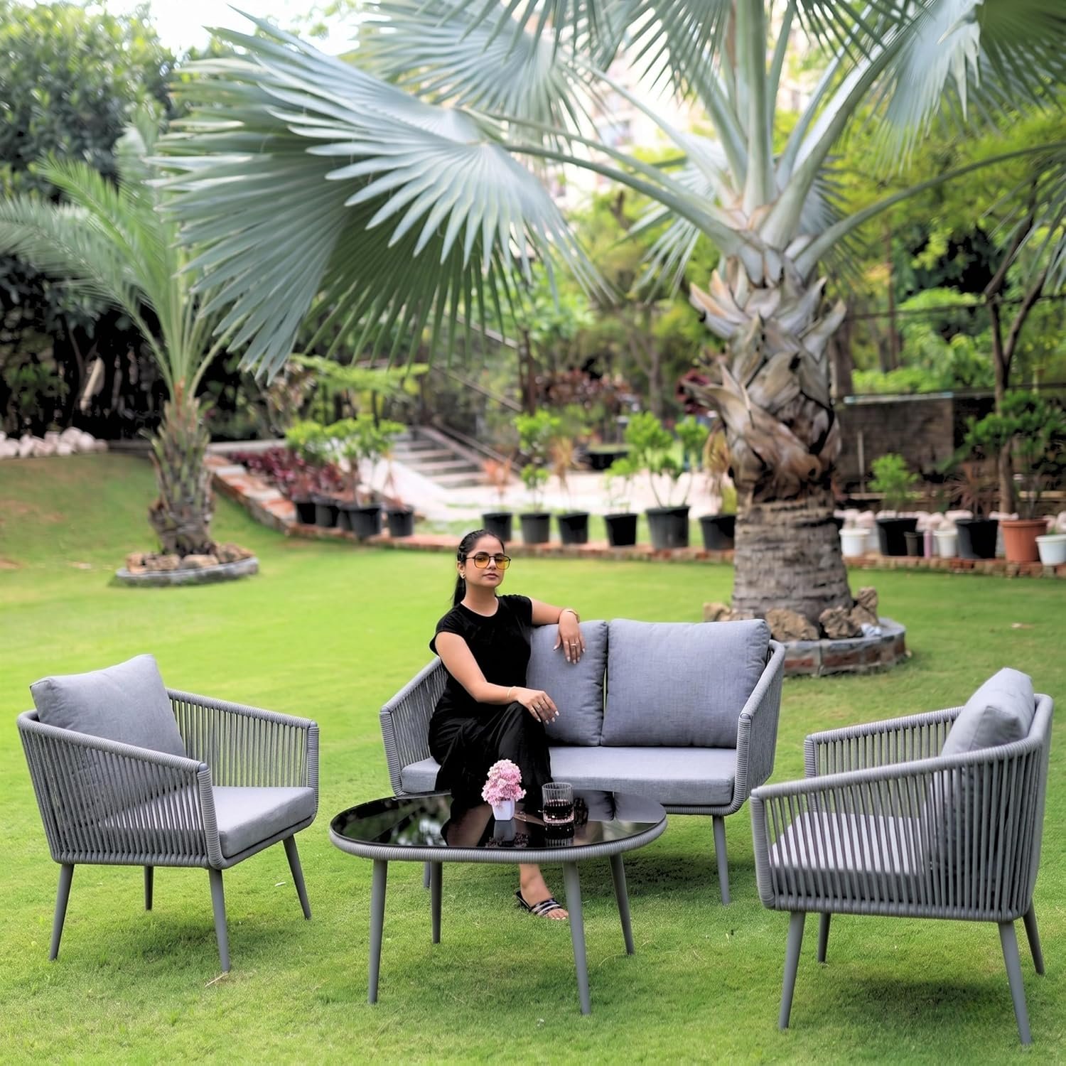 LOCCUS Outdoor Rope 4-Seater Sofa Set in grey with water-repellent cushions, durable metal frame, and handwoven rope design. Includes a stylish glass top table, perfect for garden, patio, pool deck, or balcony outdoor furniture.